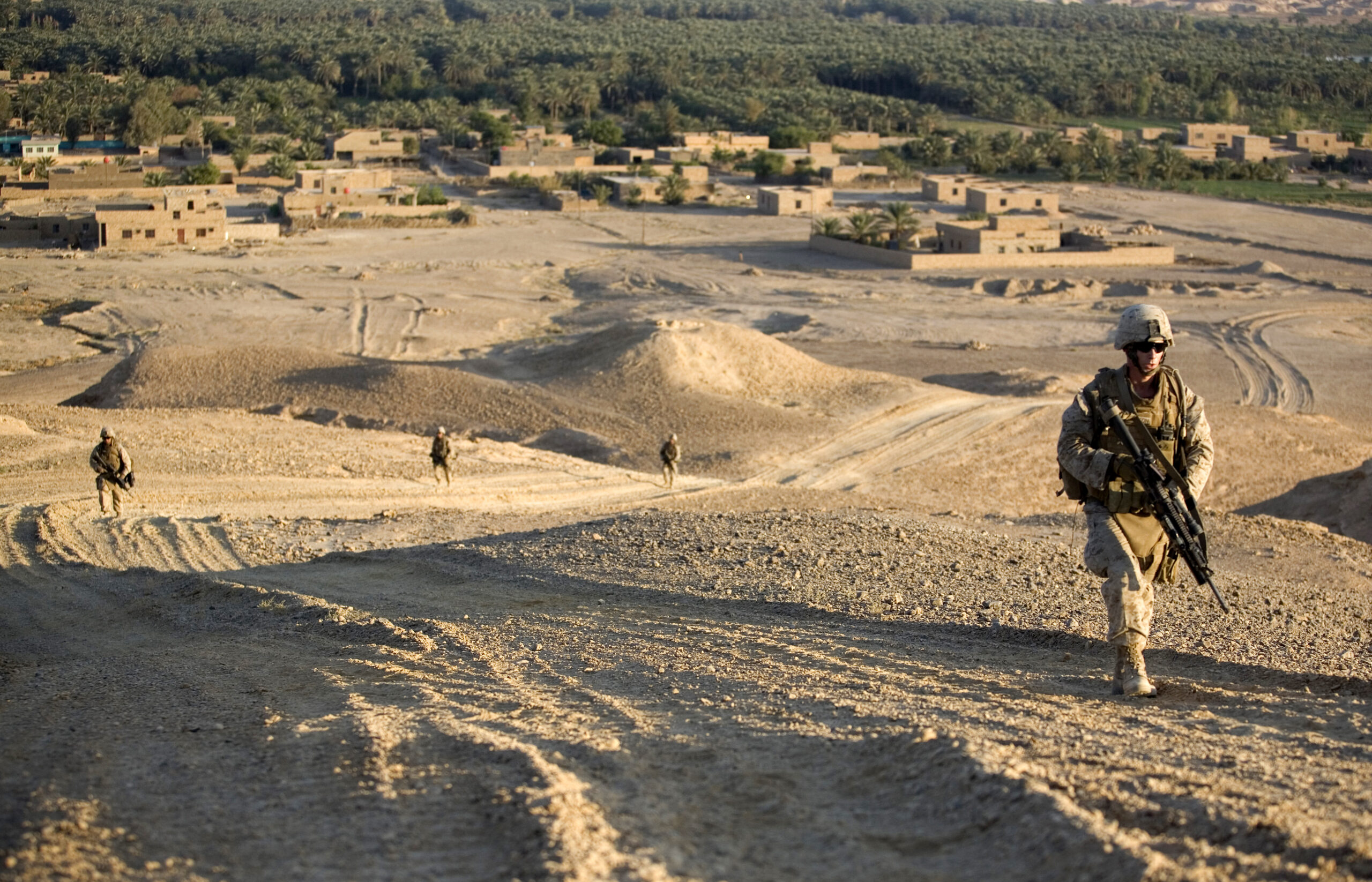 U.S. Marines from 1st Platoon, Alpha Company, 1st Battalion, 7th Marine Regiment patrol from Expeditionary Patrol Base Dulab to a ridge along the outskirts of Dulab, Iraq, Sept. 26, 2007. The Marines are working with Iraqi police in support of Operation Iraqi Freedom in the Al Anbar province of Iraq. (U.S. Marine Corps photo by Cpl. Shane S. Keller) (Released)